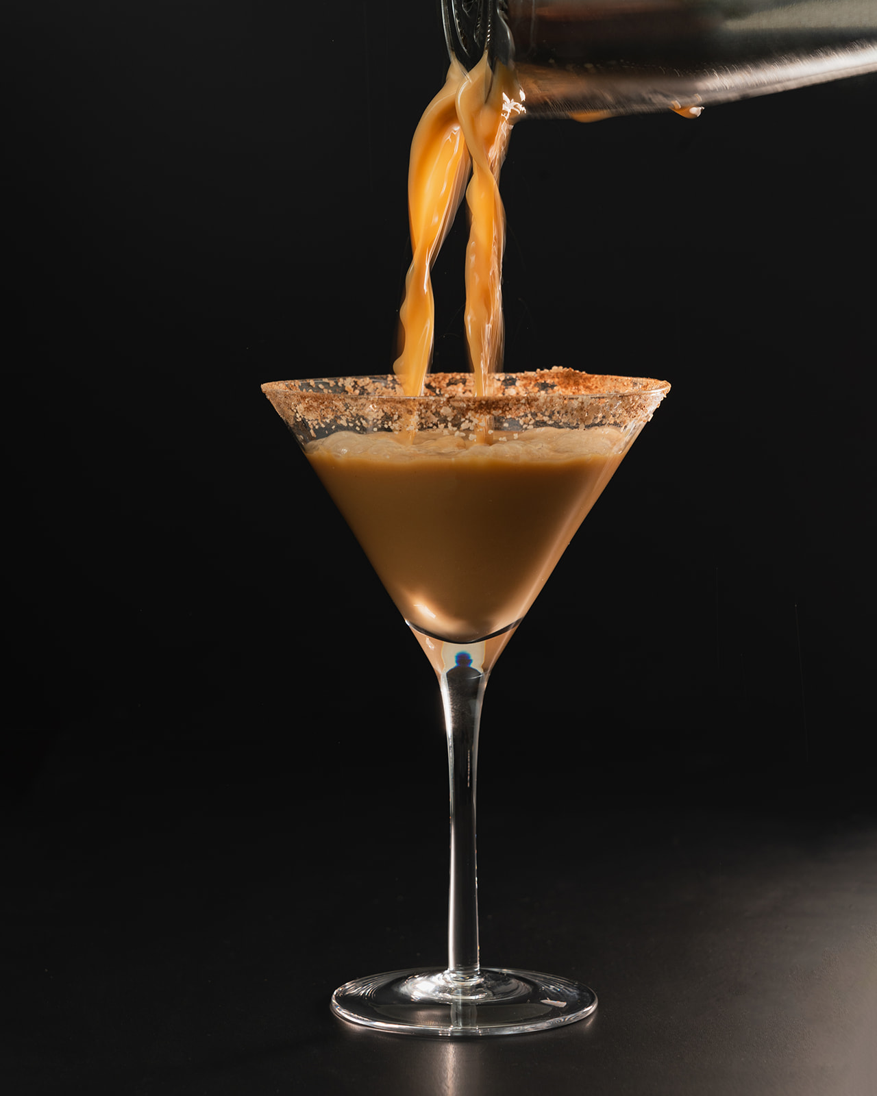 Pumpkin Spice Espresso Martini being poured from a shaker